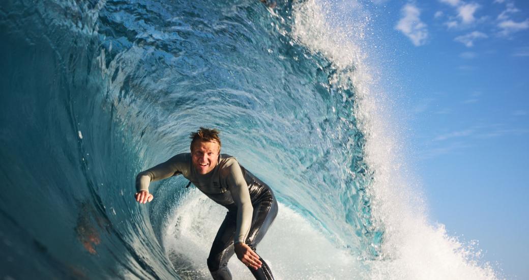 A surfer in a wave tunnel close up 